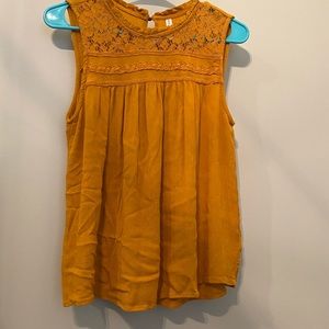 Mustard color tank, front top part is floral/lace